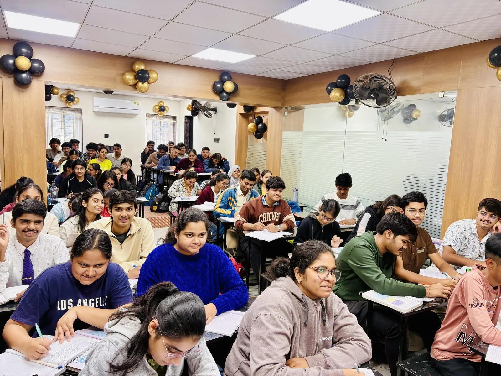 Teacher instructing students in a decorated classroom