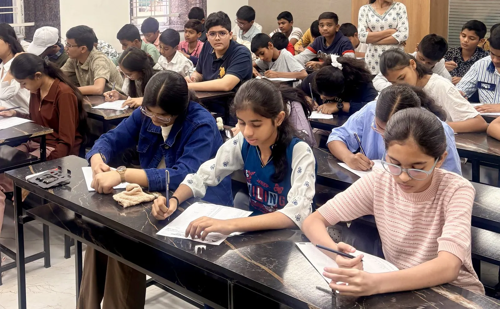 Female mentor with student holding books