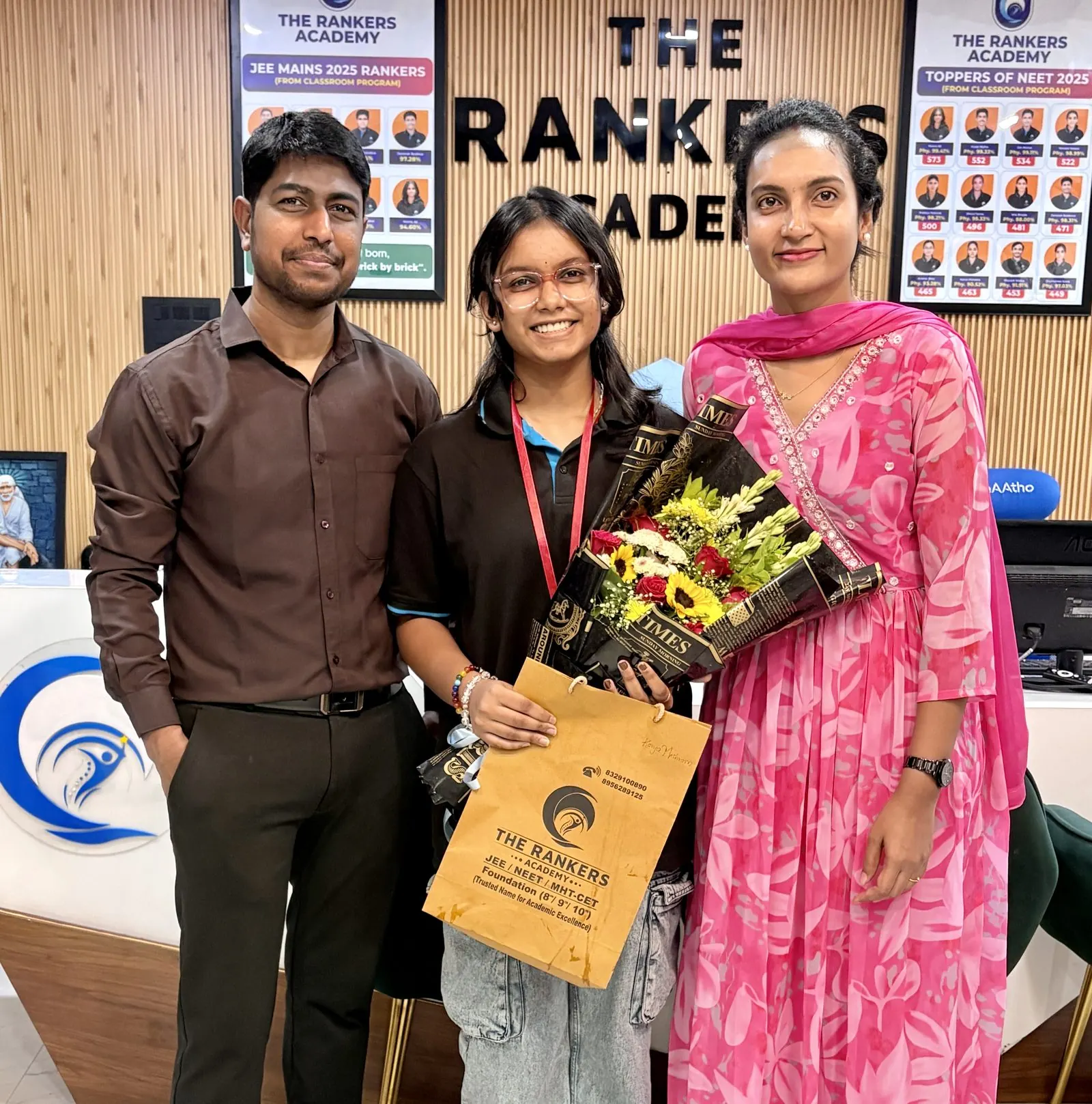Founders receiving gifts and bouquets at an event