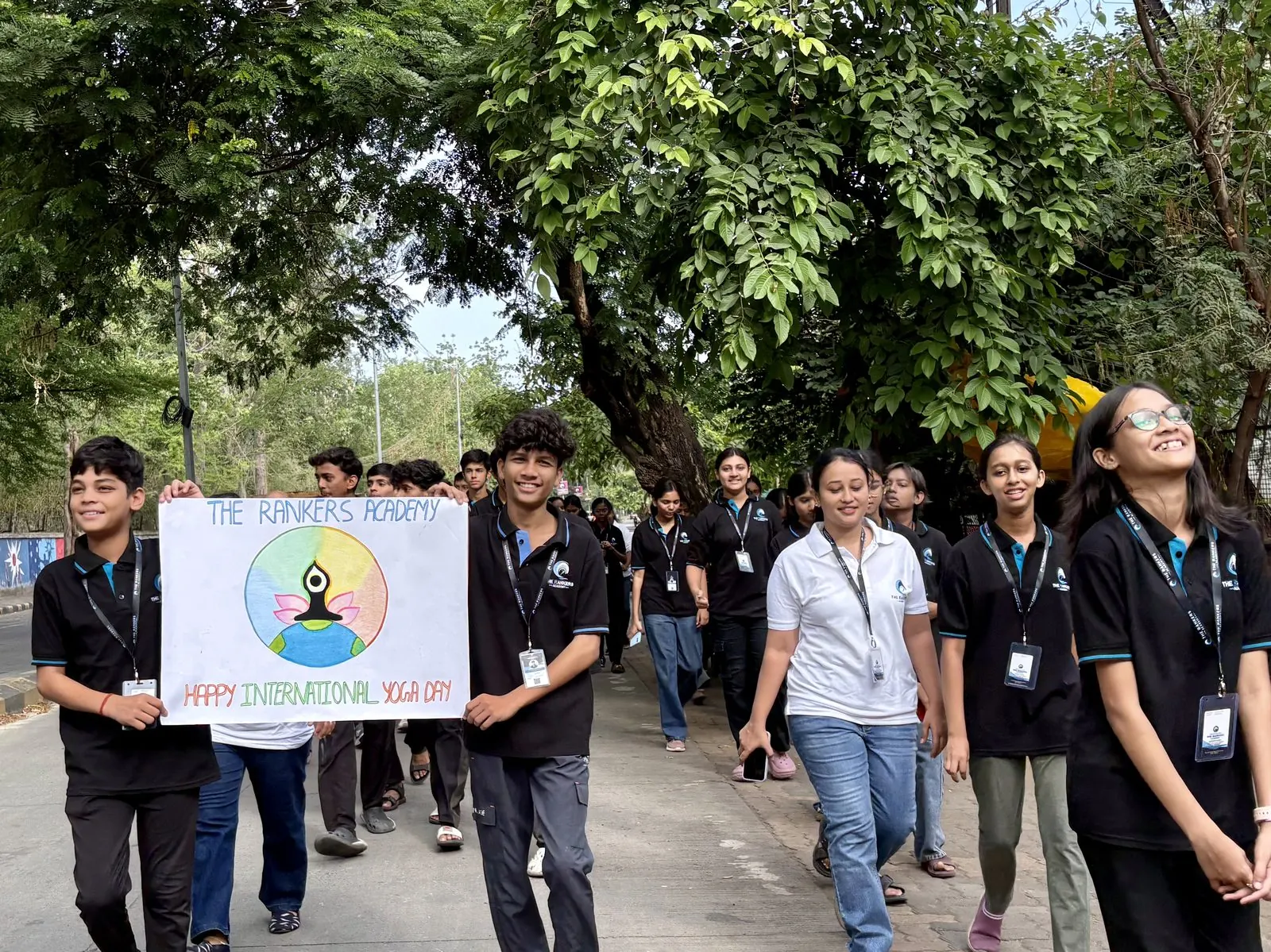 Students carrying banner during an outdoor event