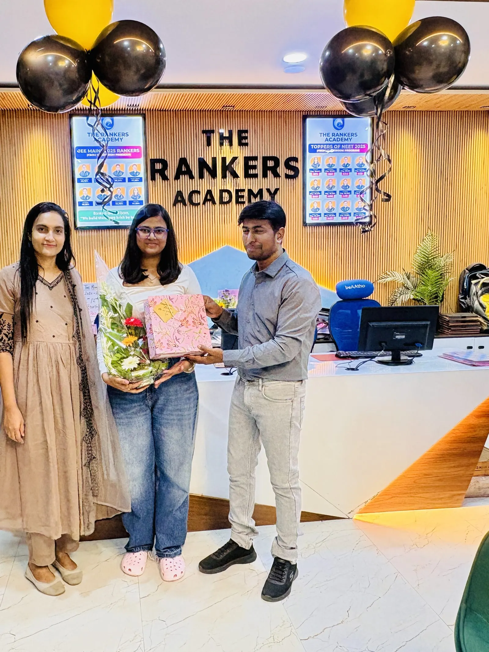 Students being felicitated inside the office