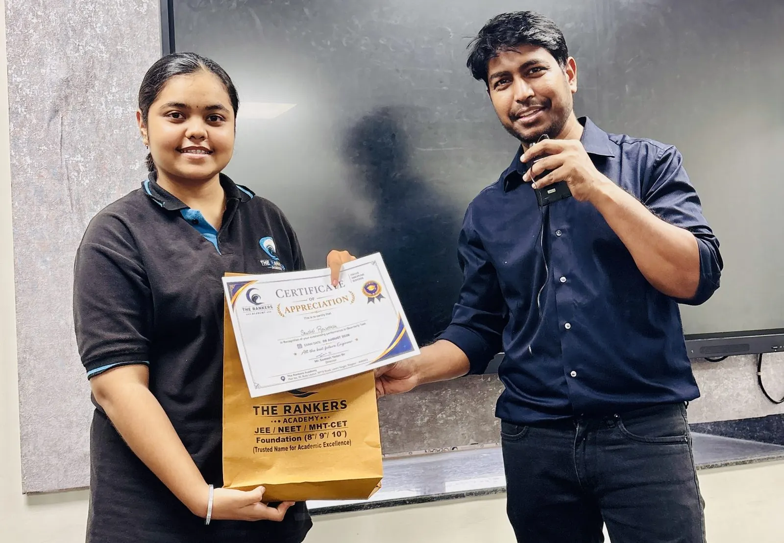 Founders with certificate and gifts at a ceremony
