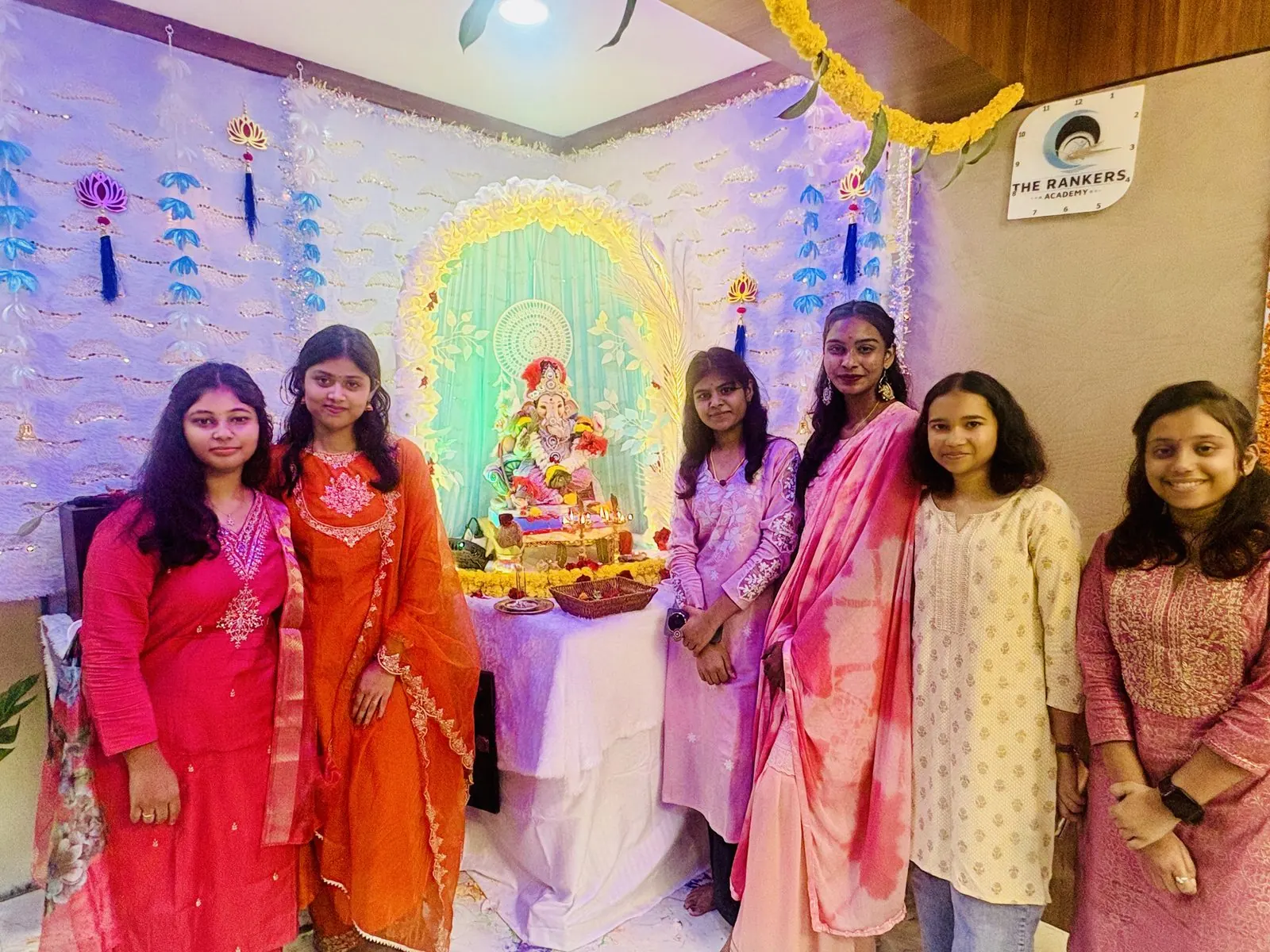 Student group in festive attire celebrating together